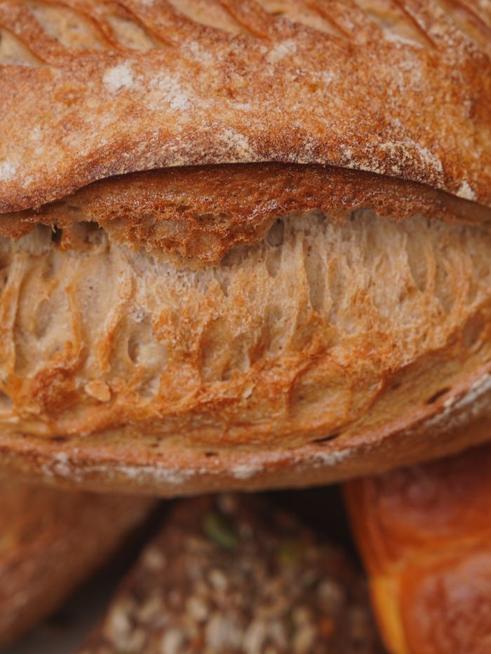 Mastering the First Impression: Your intriguing post title goes here A detailed close-up of freshly baked sourdough bread, showcasing texture and crust.